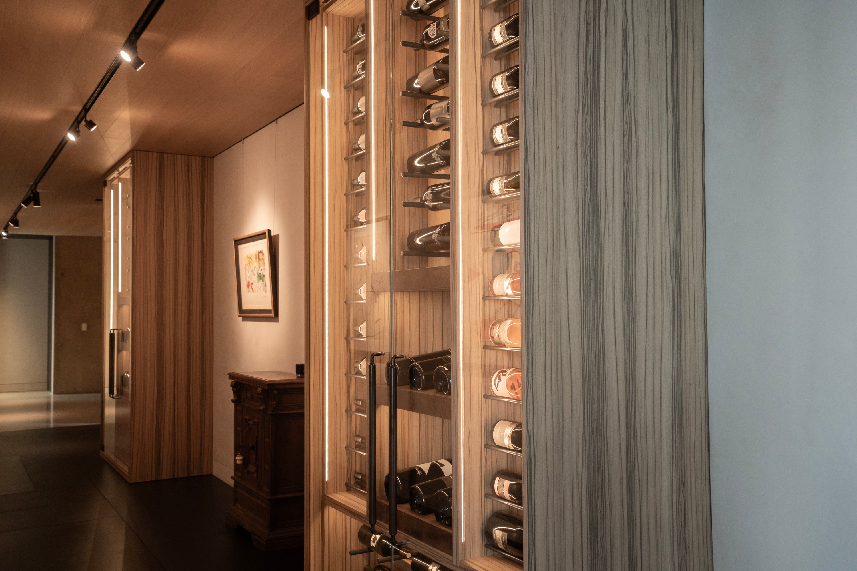 Wine rack with bottles in a modern interior setting. BWP Spaces crafted wine cabinets, kitchens, and vanities in Olson Kundig home